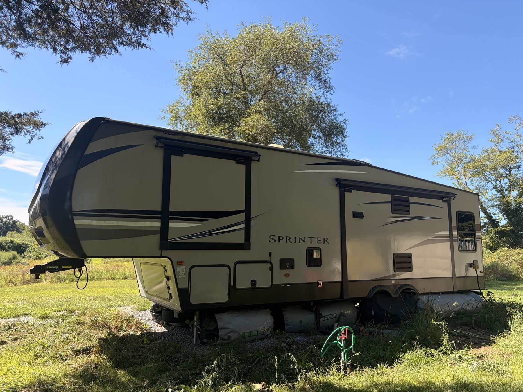 Off-door side of the fifth wheel with both slides out, Franklin CT, August 2026